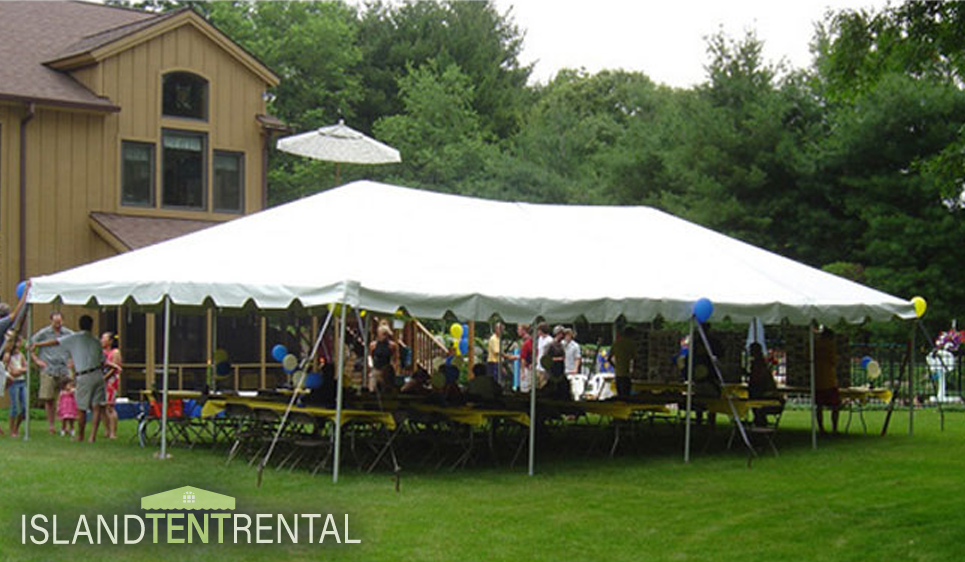 20 by 40 tent set with tables and guests